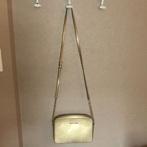 Michael Kors gold purse with wallet